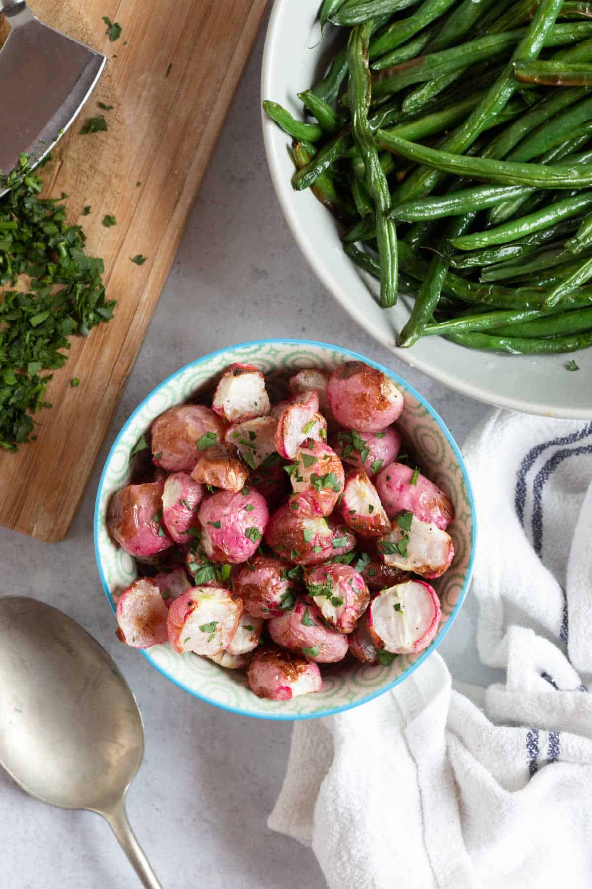 Roasted air fryer radishes sprinkled with chopped parsley.