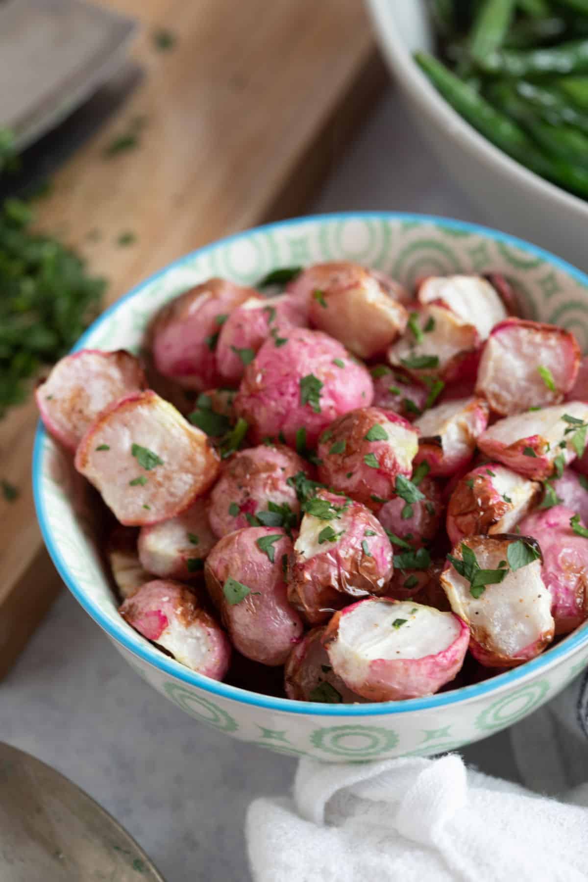 Air fryer radishes in a serving bowl.