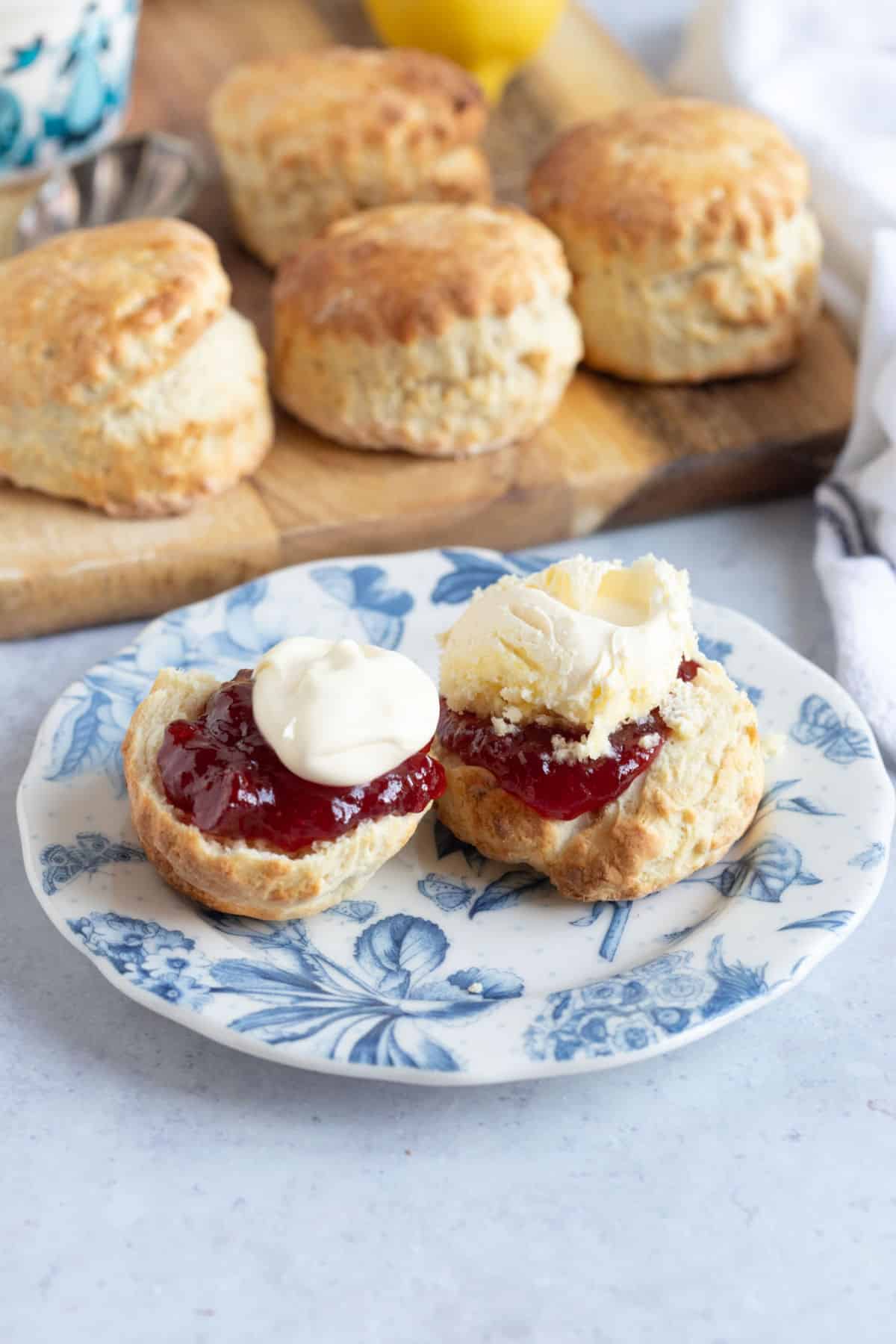 Scones made in an air fryer, served with jam and cream.