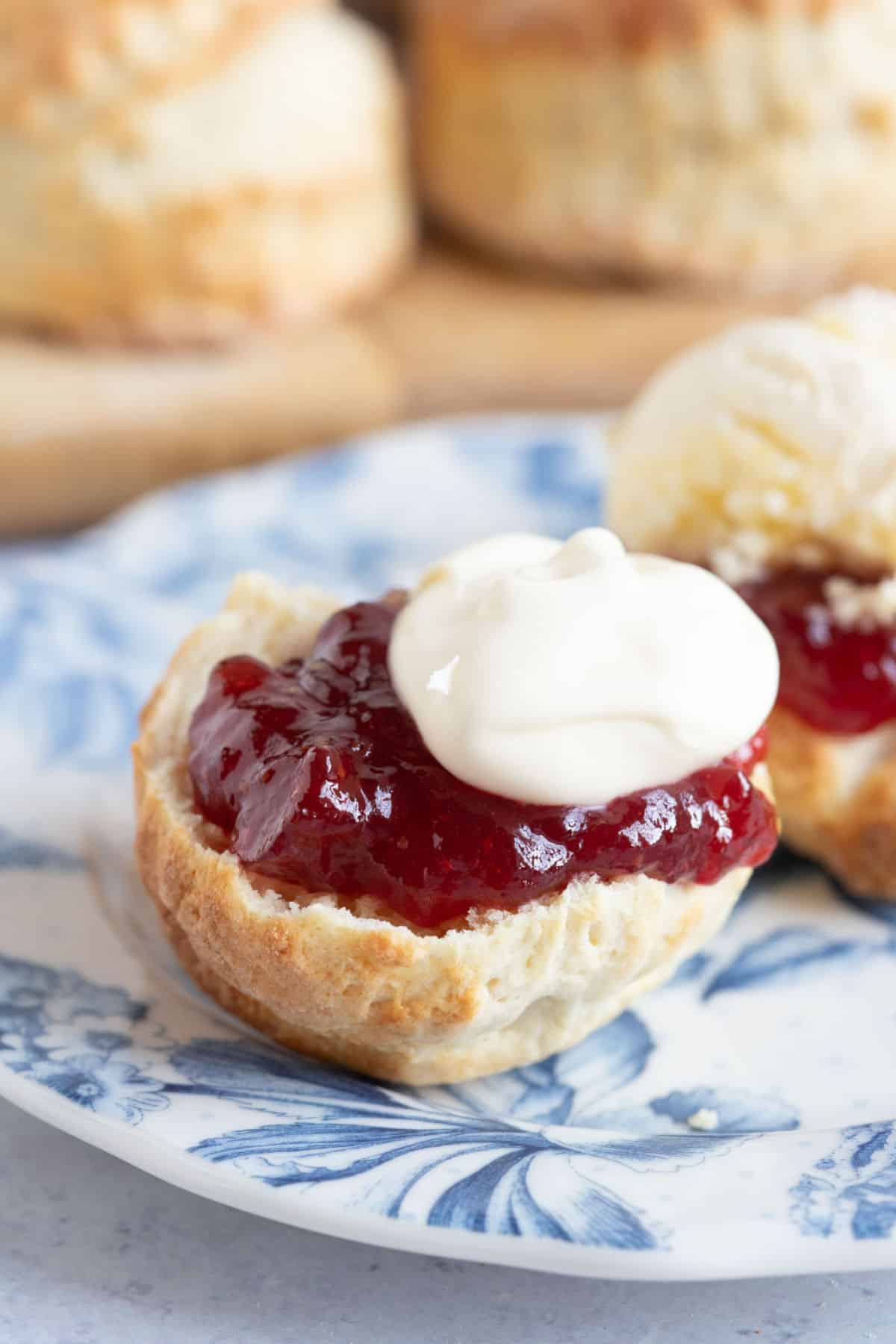 A scone with jam and clotted cream.