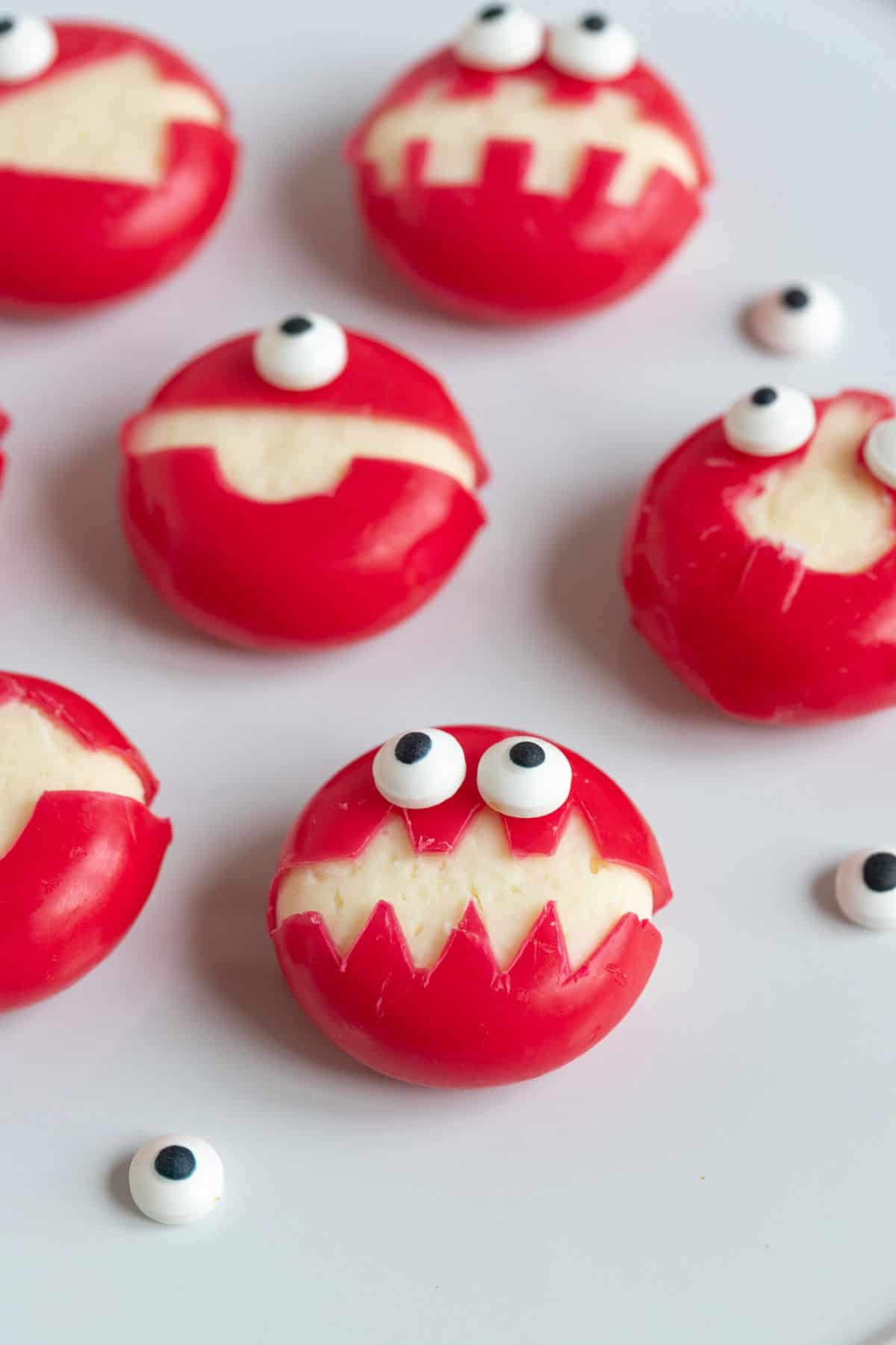 Babybel cheese monsters with edible eyes.