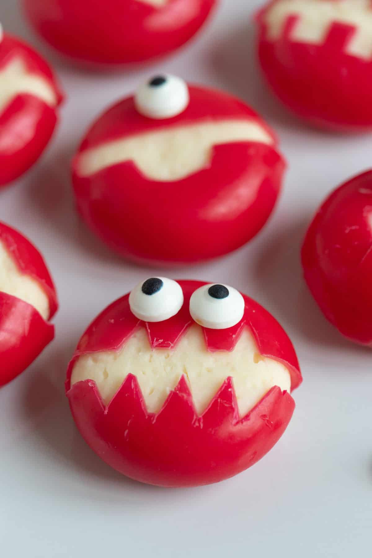 Babybel cheese monsters on a plate.