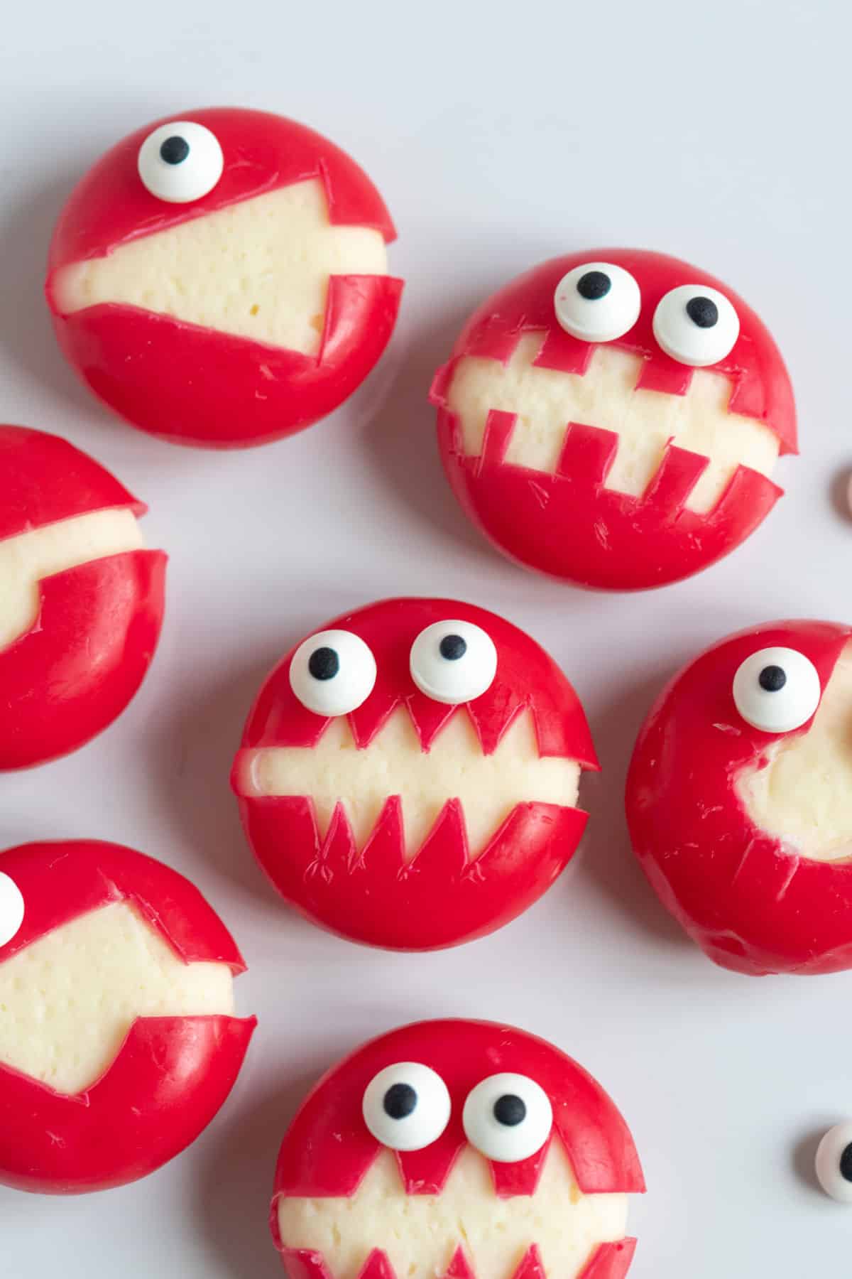 Babybel cheese monsters with edible eyes.