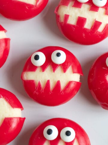 Babybel cheese monsters on a plate.