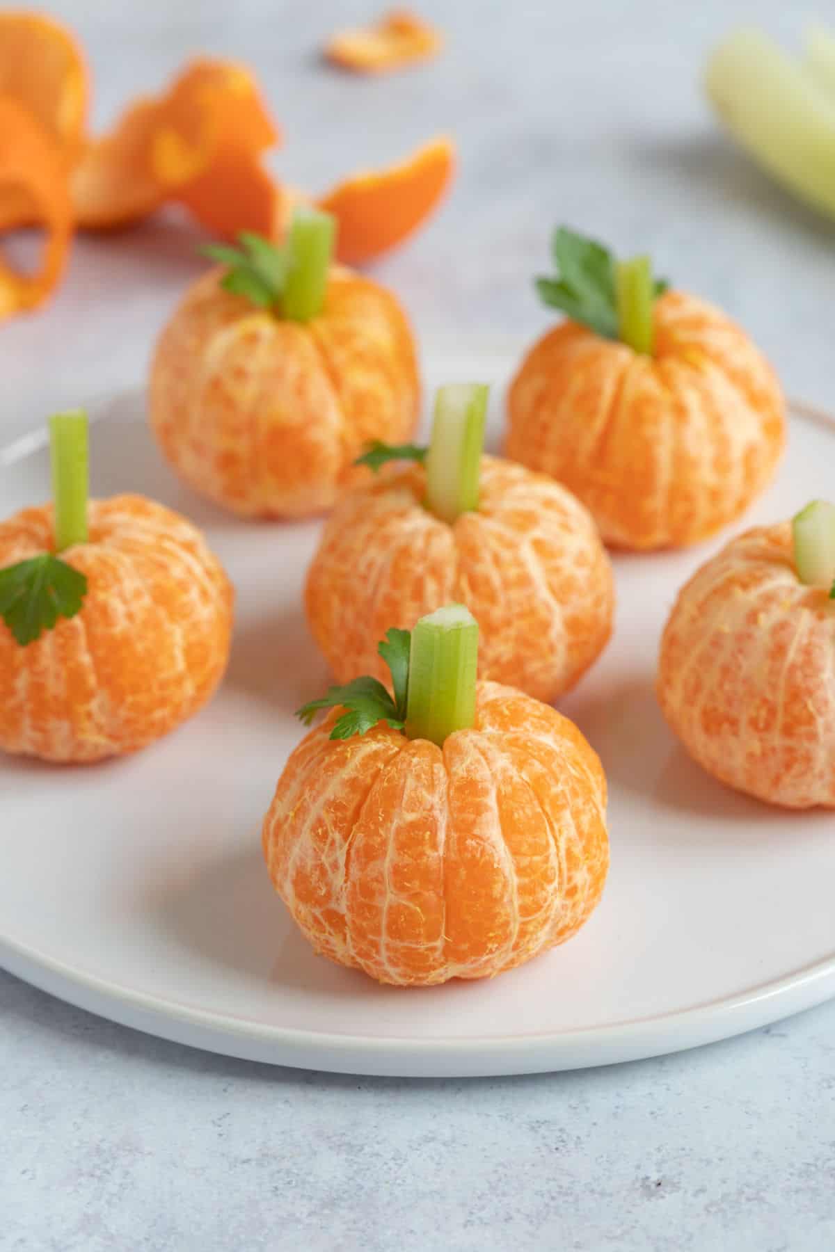 A plate of Halloween clementine pumpkins.