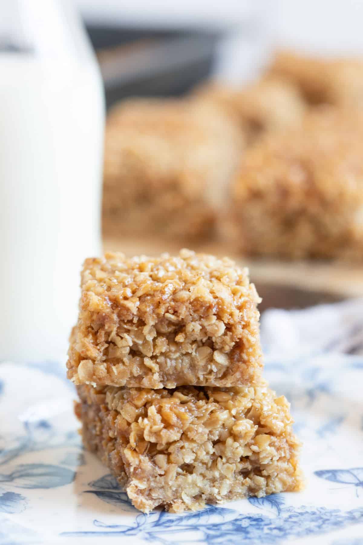 A stack of flapjacks on a blue and white plate.