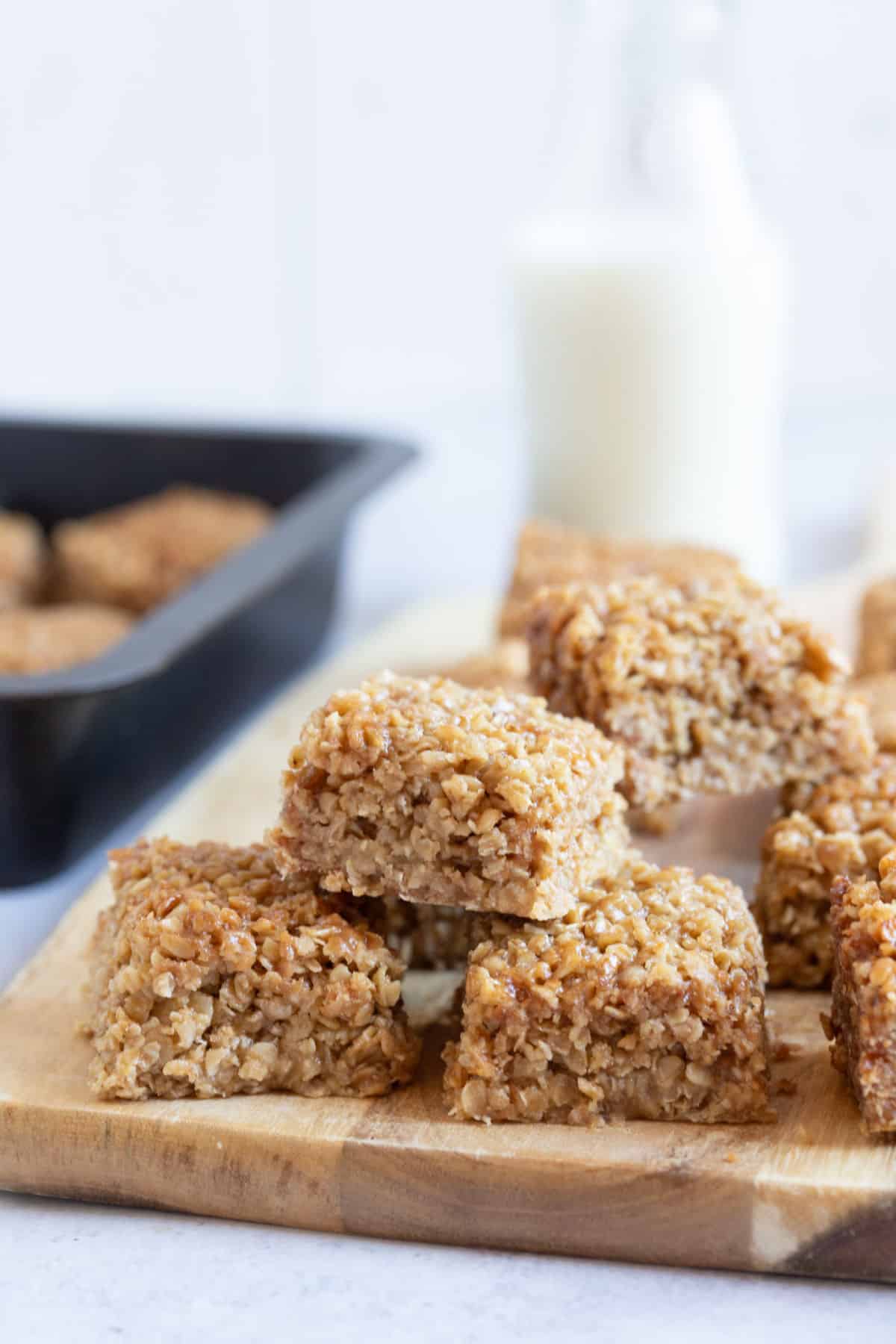 Flapjack bars on a wooden board.