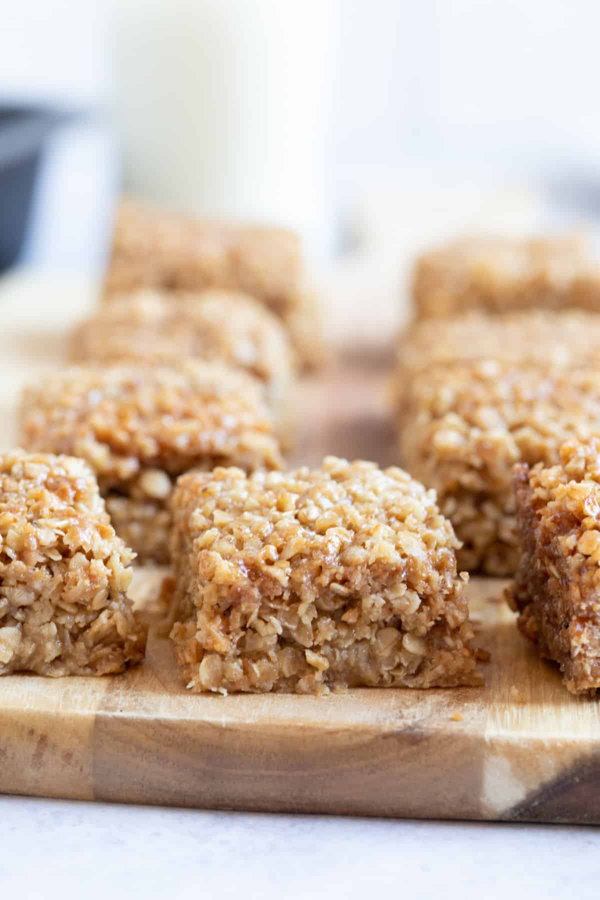 Soft squidgy flapjacks on a wooden board.