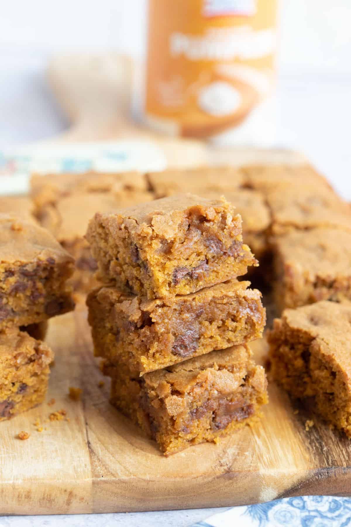 A stack of fudgy pumkpin spice blondies.