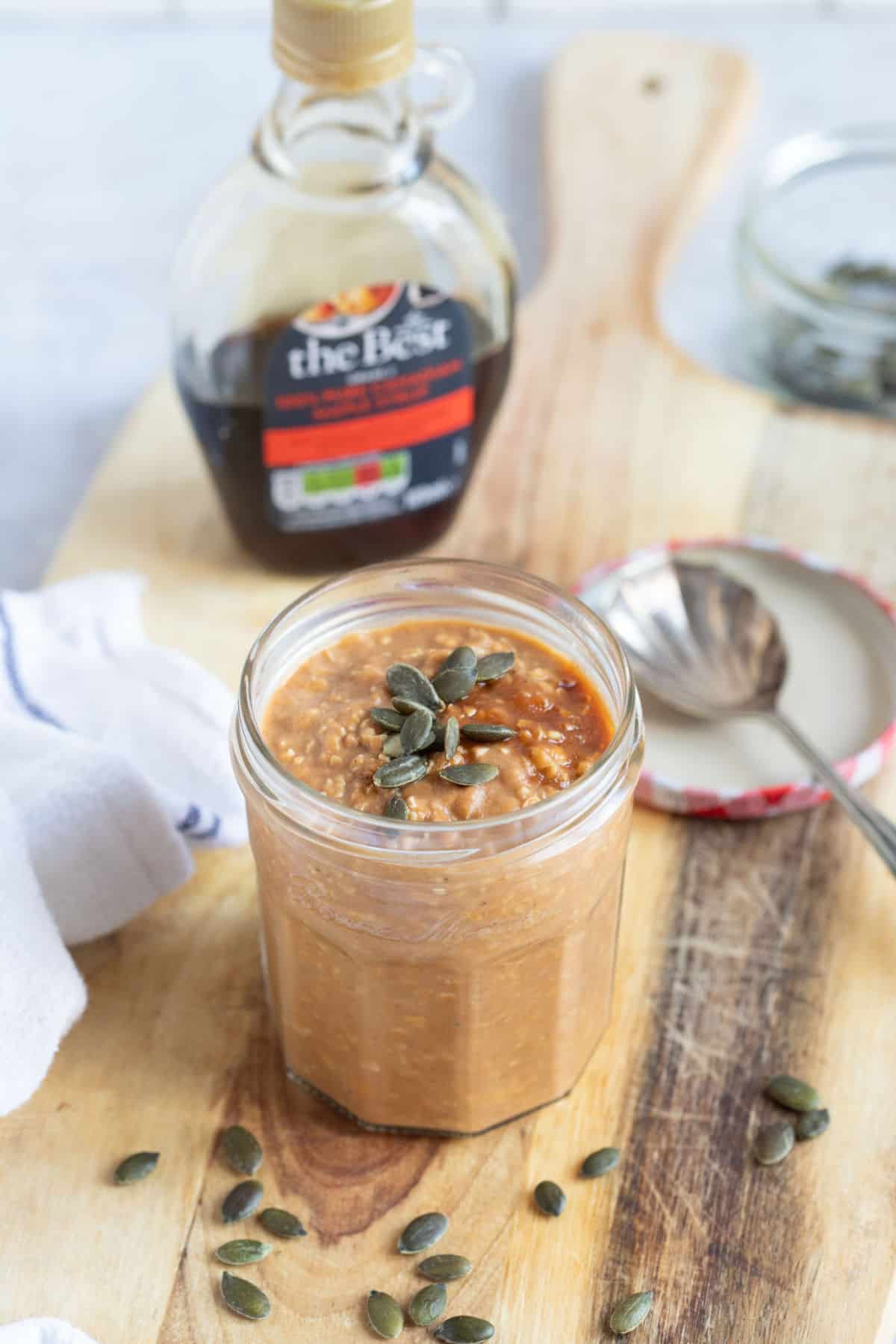 Pumpkin overnight oats in a glass jar.