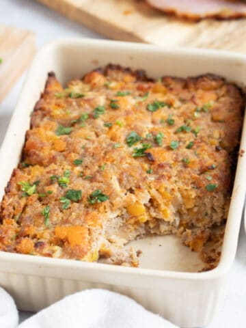 Apricot and sausage meat stuffing in a dish.