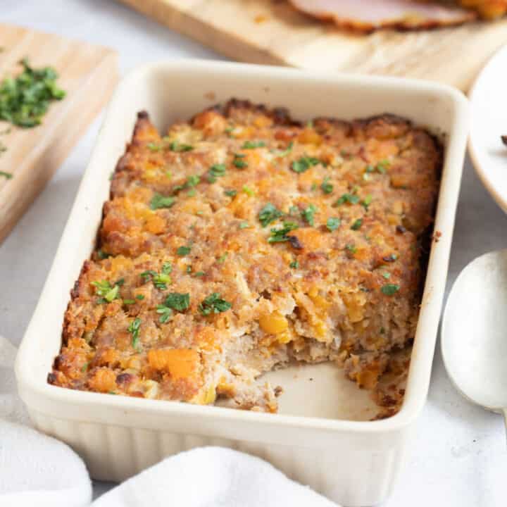 Apricot and sausage meat stuffing in a dish.