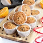 Christmas cake muffins on a wooden board.