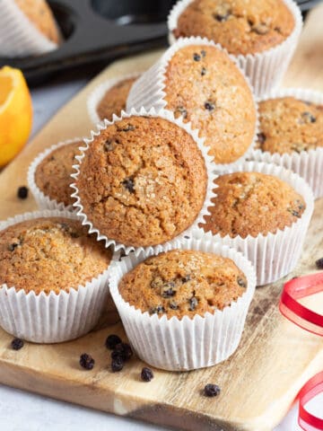 Christmas cake muffins on a wooden board.