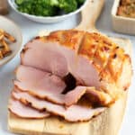 Honey roast gammon on a serving board.