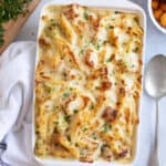 Leftover turkey pasta bake in a white baking dish.