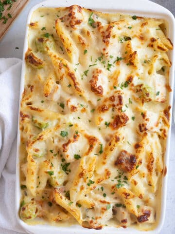 Leftover turkey pasta bake in a white baking dish.