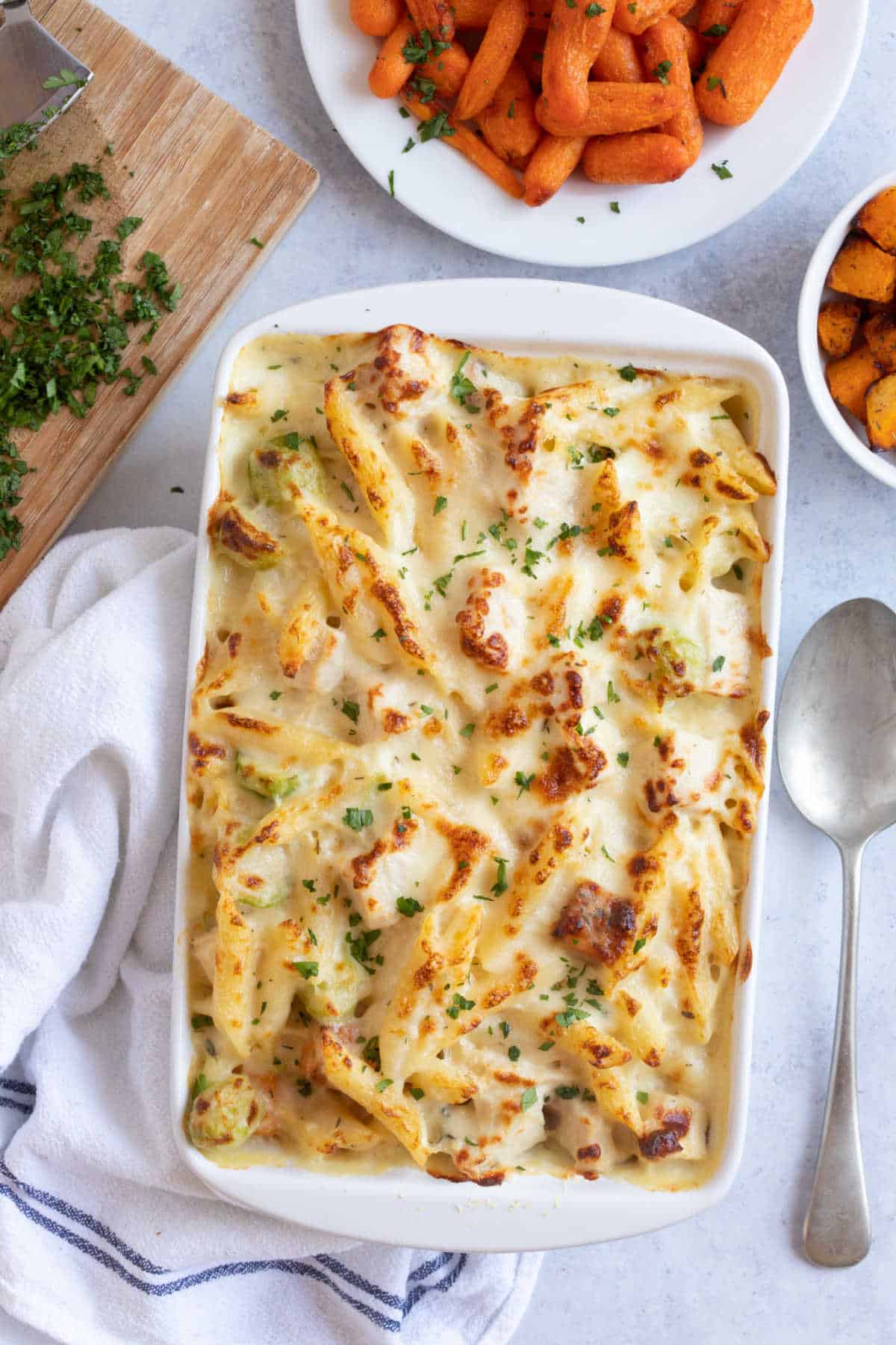 Leftover turkey pasta bake in a white baking dish.