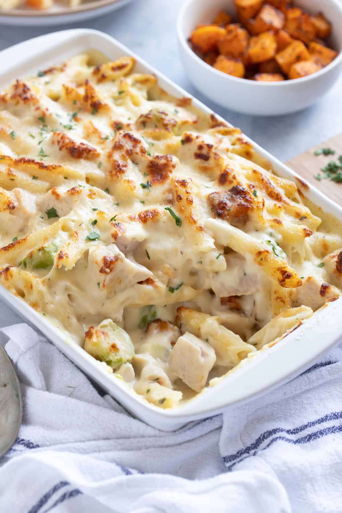 Leftover turkey pasta bake garnished with parsley.