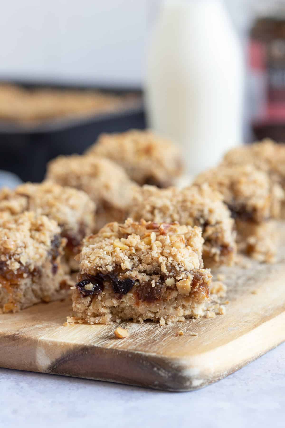 Mincemeat slices on a wooden board.