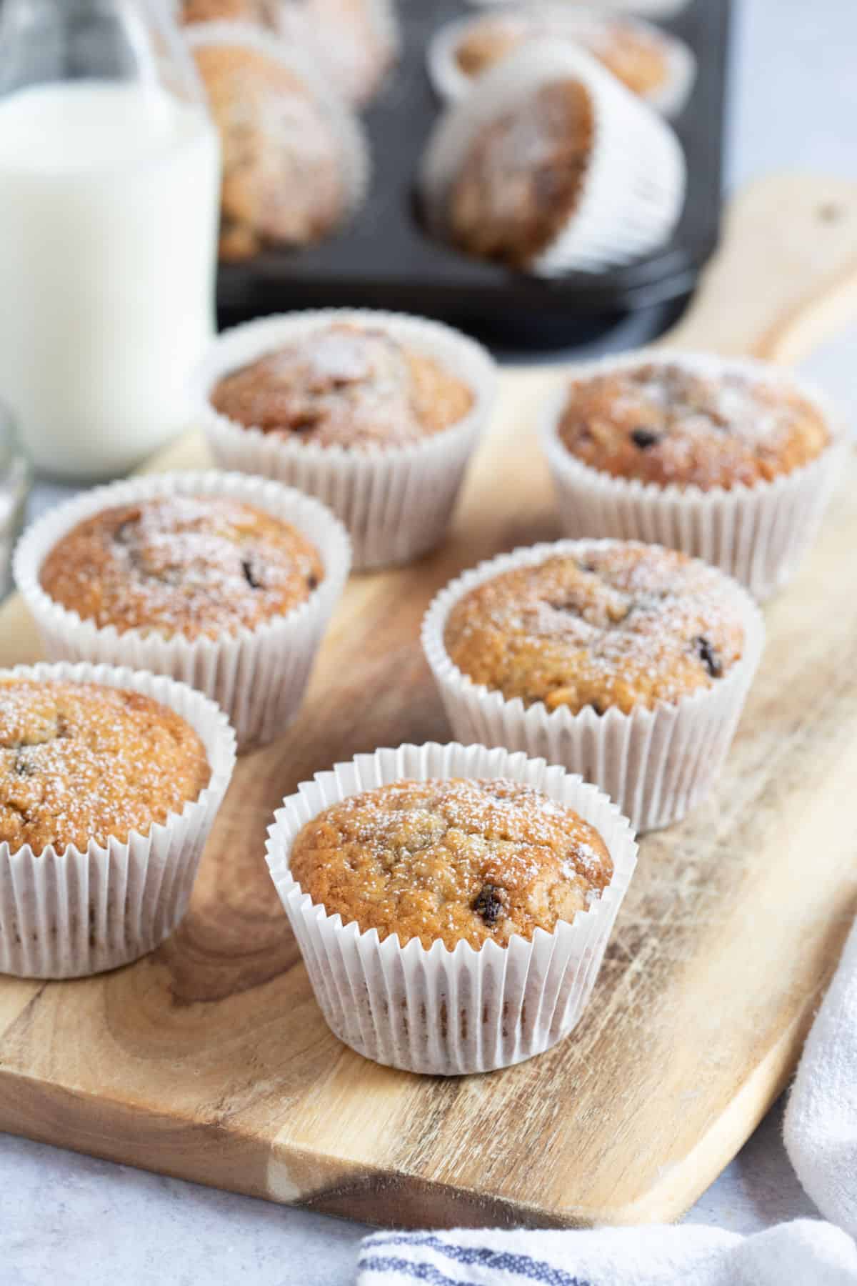 Stollen muffins on a wooden board.