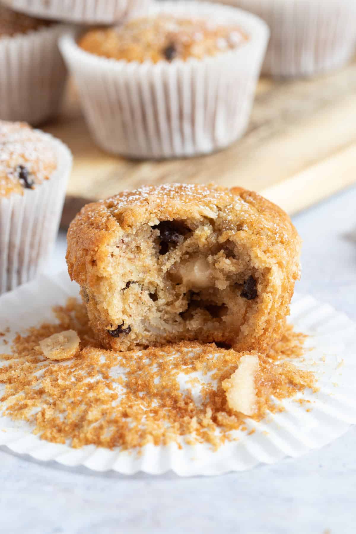 A half eaten stollen muffin in a muffin wrapper.