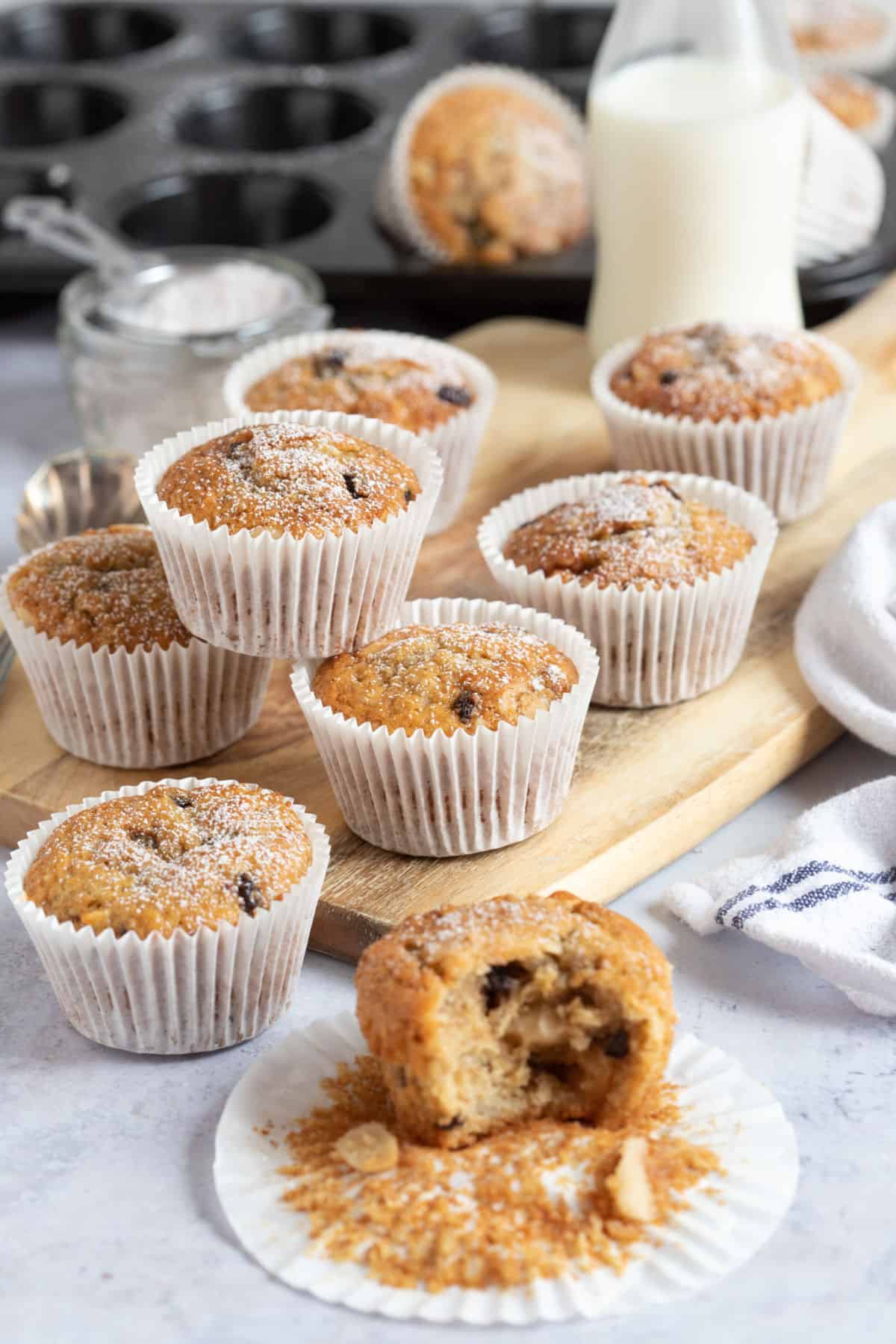 Stollen muffins with a glass of milk in the background.