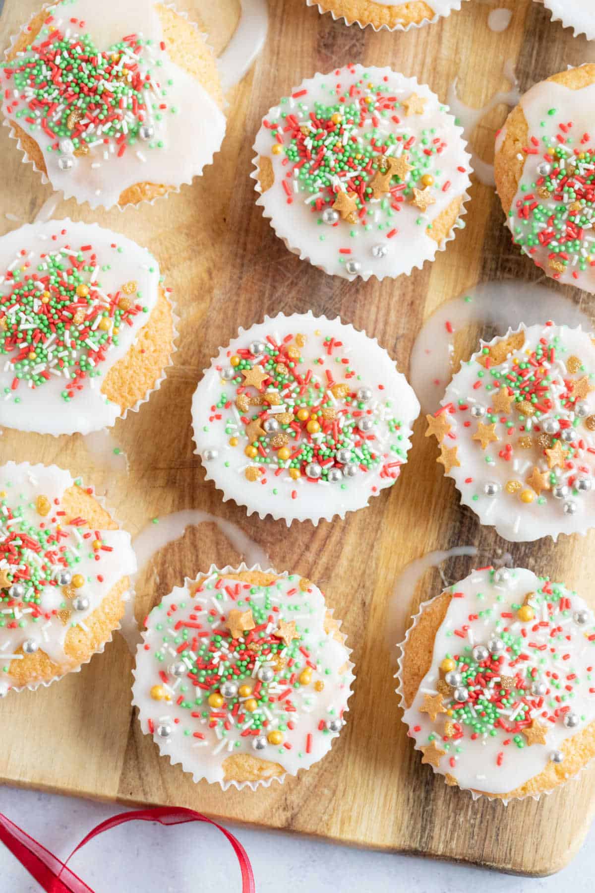 Christmas fairy cakes with sprinkles.