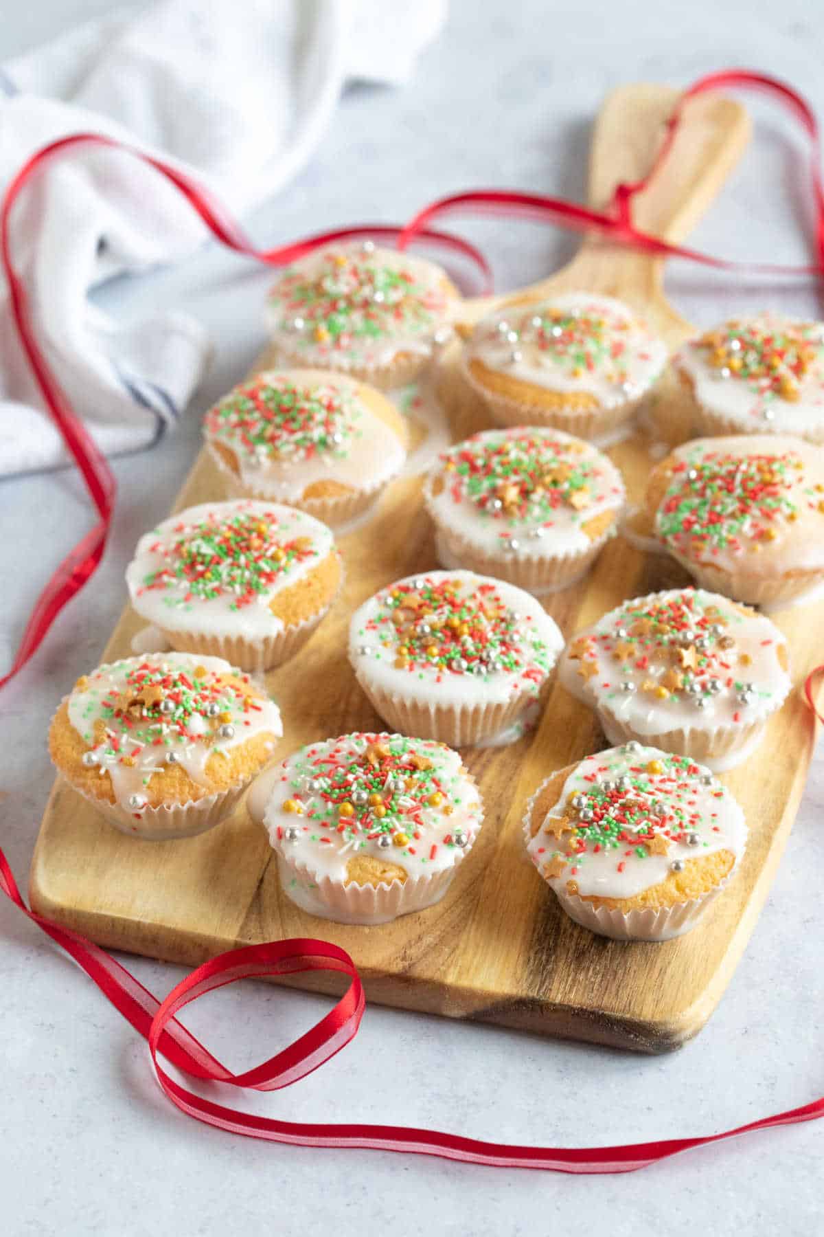 Fairy cakes on a wooden board.