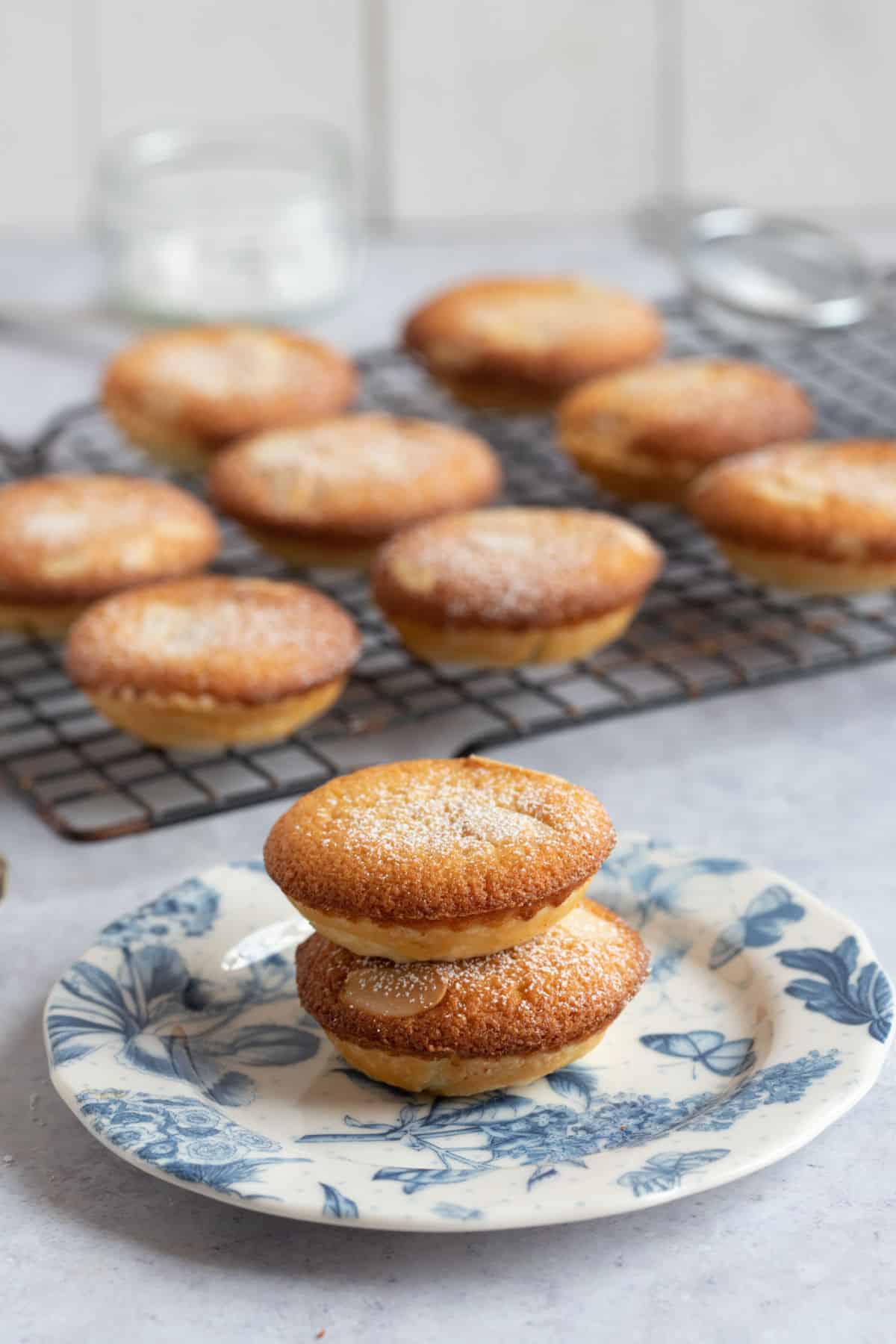 Two frangipane mince pies stacked on top of each other on a plate.