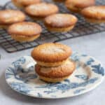 Frangipane mince pies on a blue and white plate.