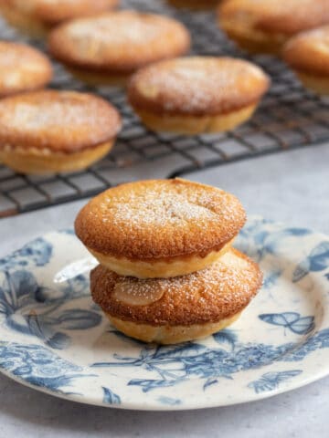 Frangipane mince pies on a blue and white plate.