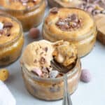 Air fryer mini egg dessert pots with a scoop of ice cream on top.