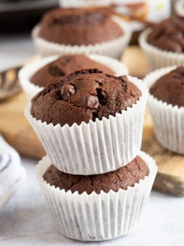 Chocolate Nutella muffins in white paper cases.