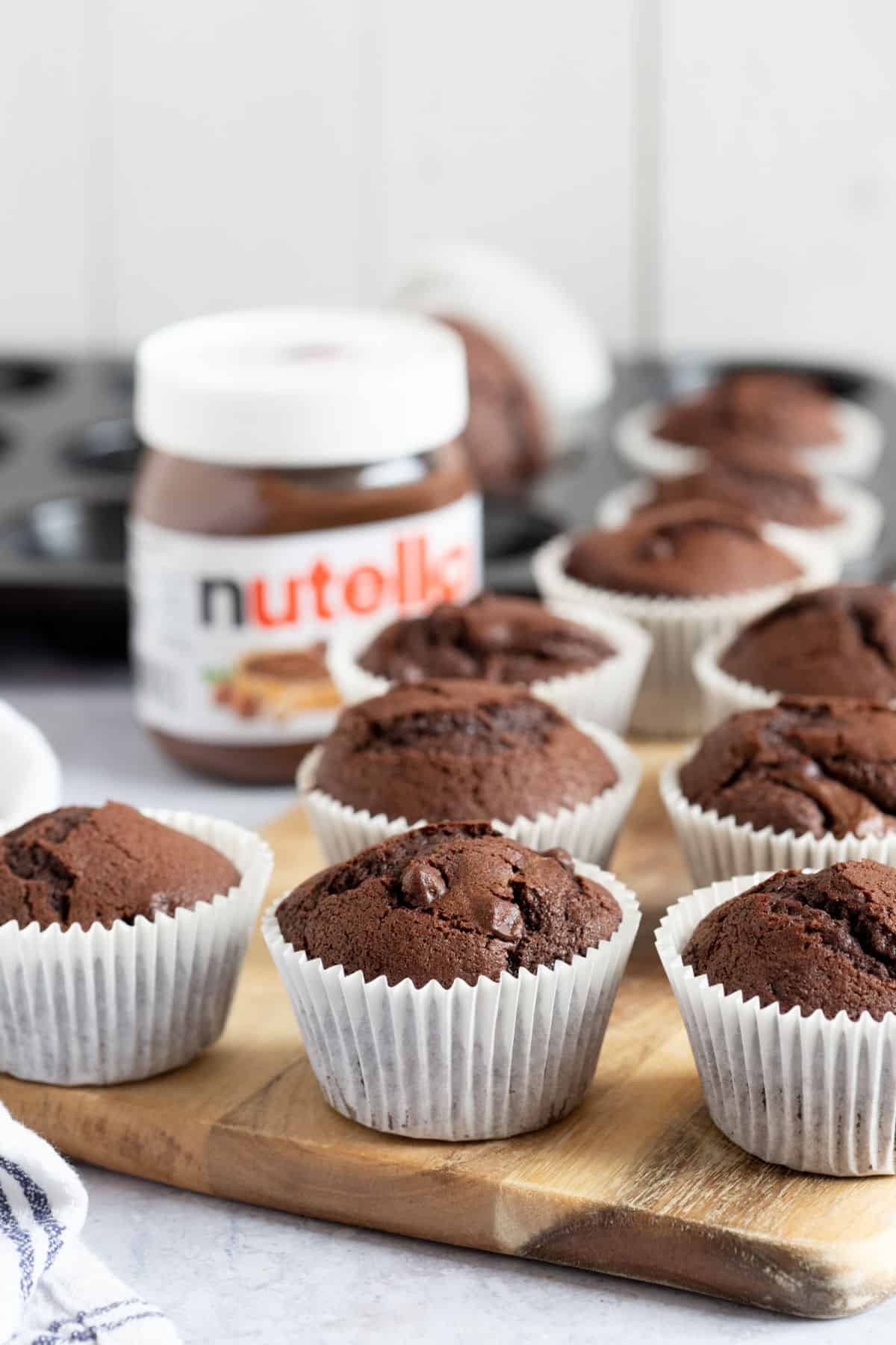 Nutella muffins on a wooden board.