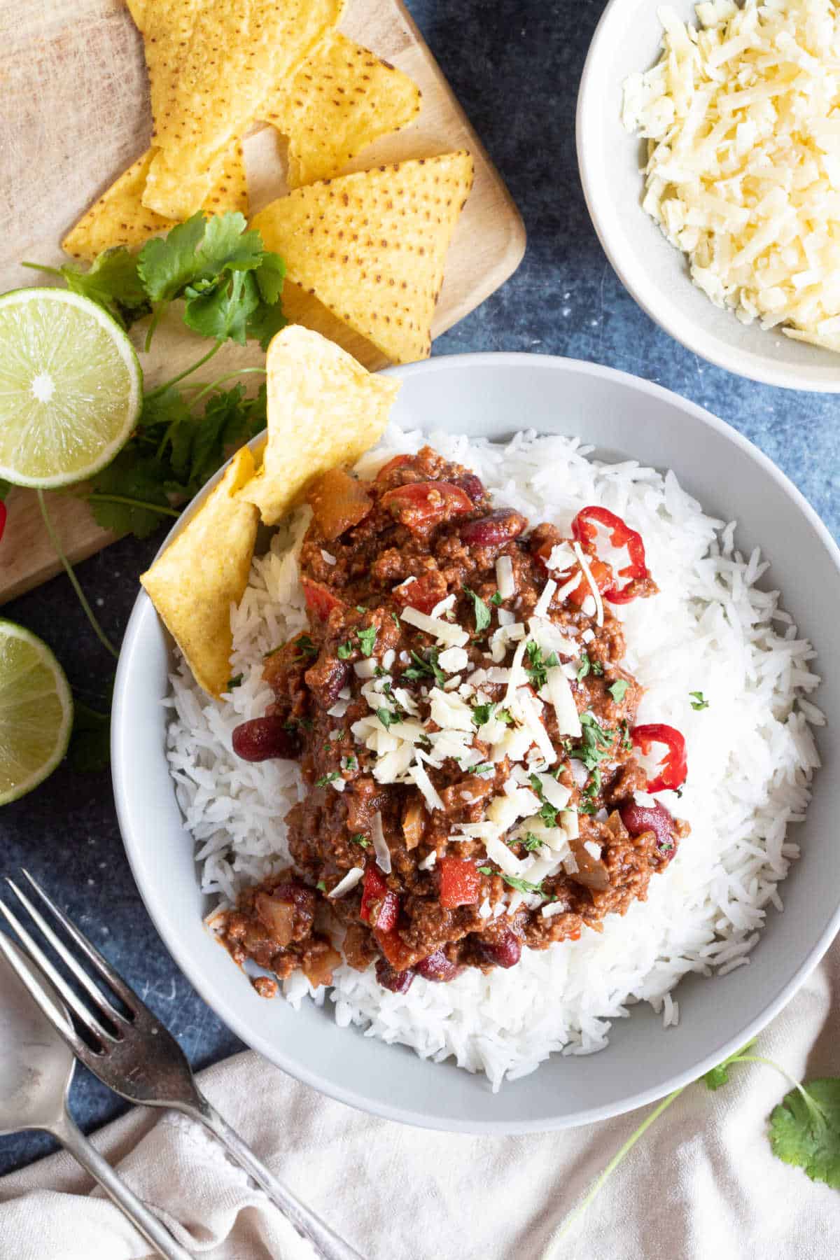 A bowl of slow cooked chilli on a bed of rice.