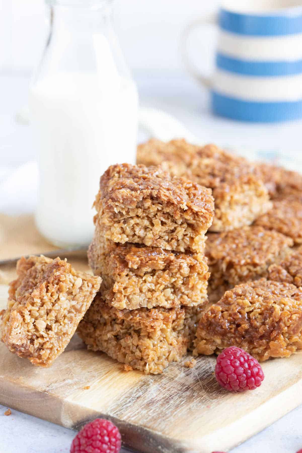 A stack of 3 air fryer flapjacks with a glass of milk in the background.