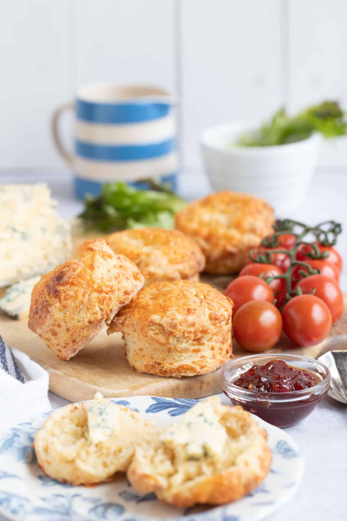 Cheese scones on a wooden board.