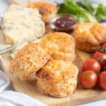 Air fryer cheese scones with cherry tomatoes and a pot of chutney.