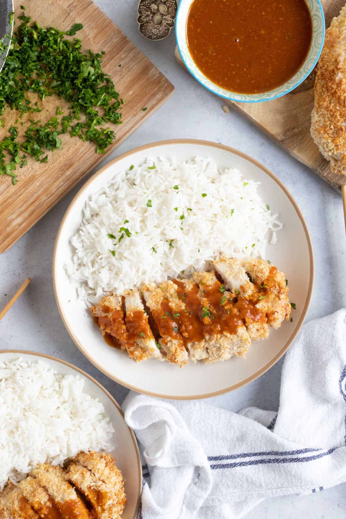 Air fried chicken katsu on a plate with rice.