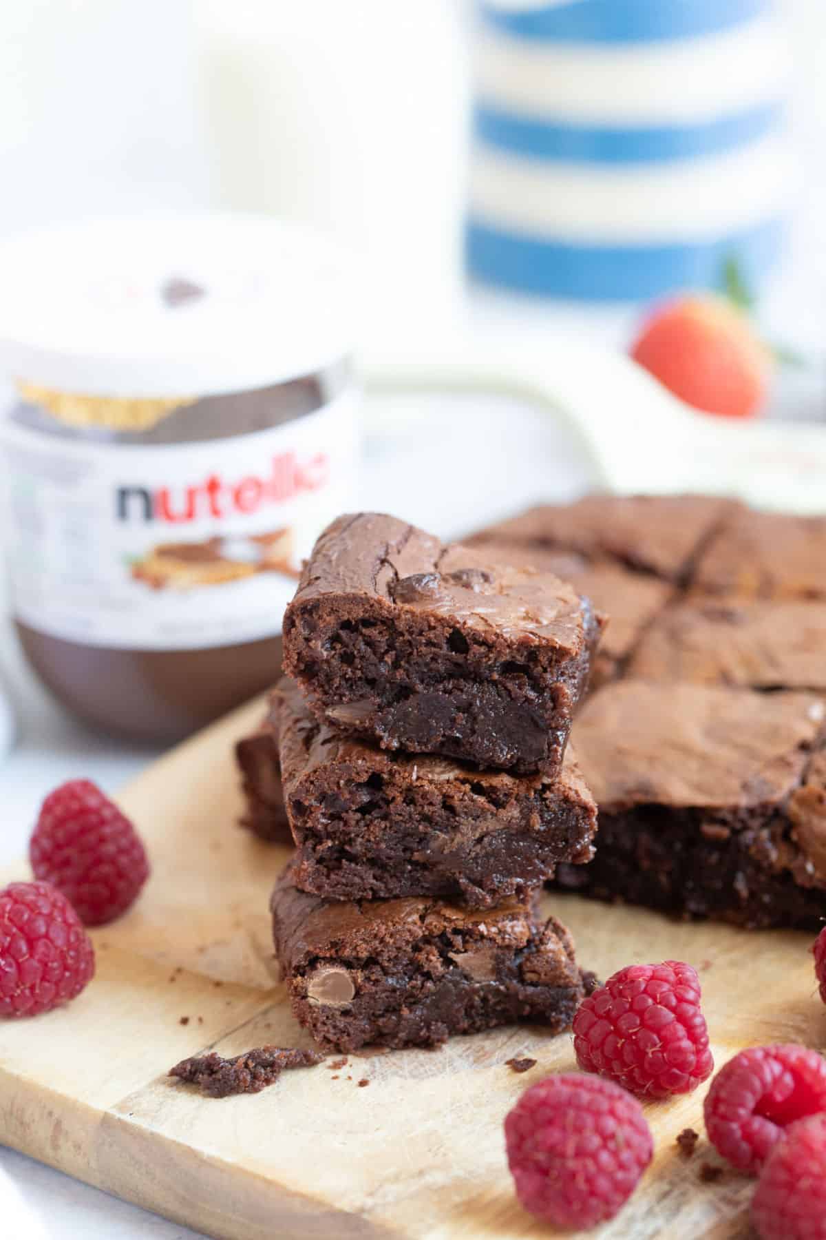 A stack of fudgy chocolate brownies.