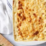 Macaroni cheese in a white baking dish.