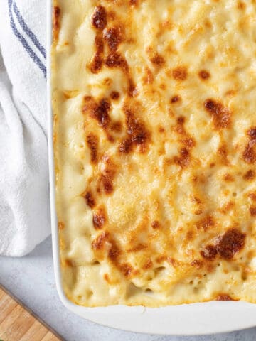 Macaroni cheese in a white baking dish.