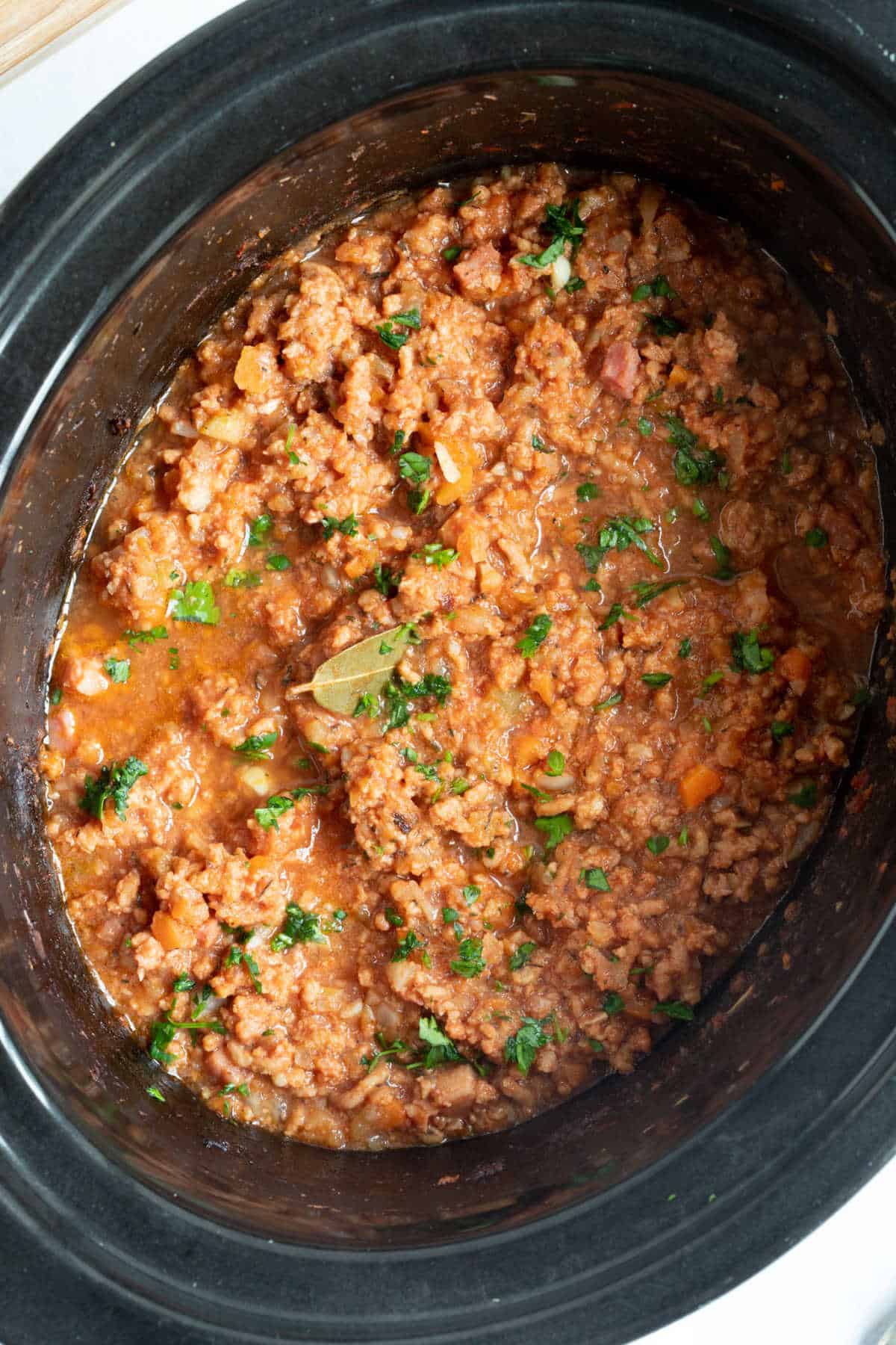 Pork ragu in a slow cooker.