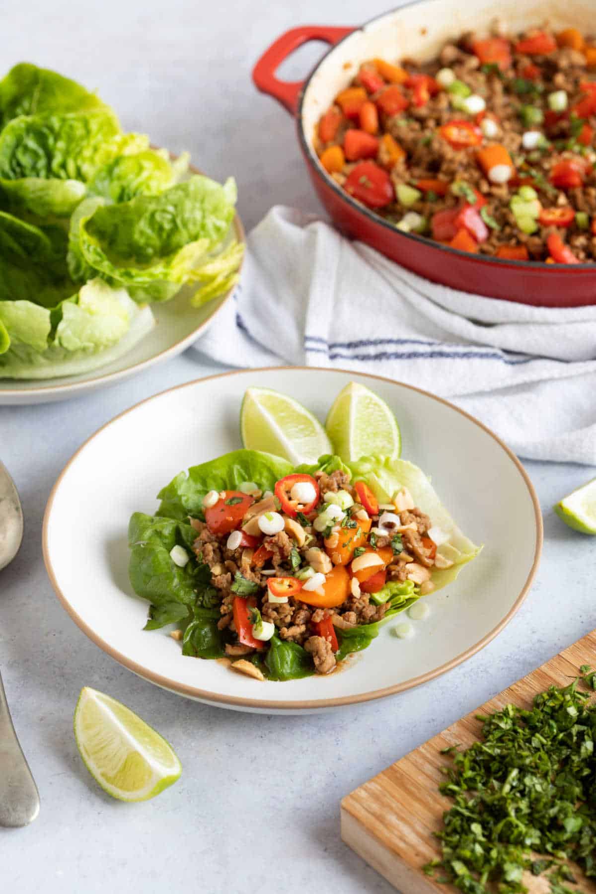 Yuk sung on a plate with peanuts, and lime wedges.