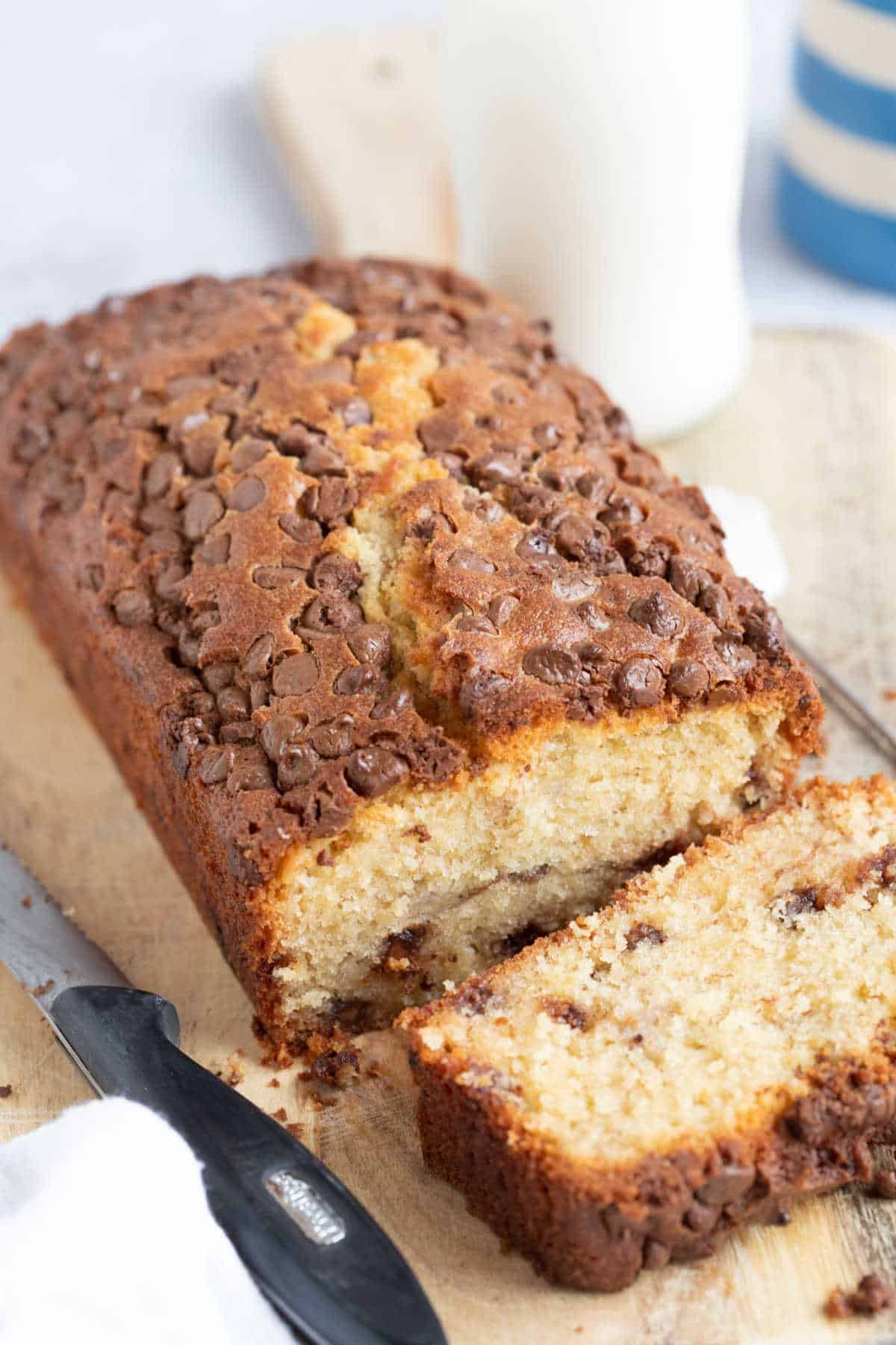 Banana bread with a slice cut off.