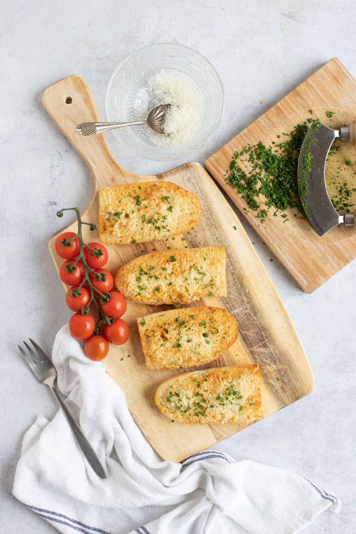 Air fryer cheesy garlic bread with parsley.