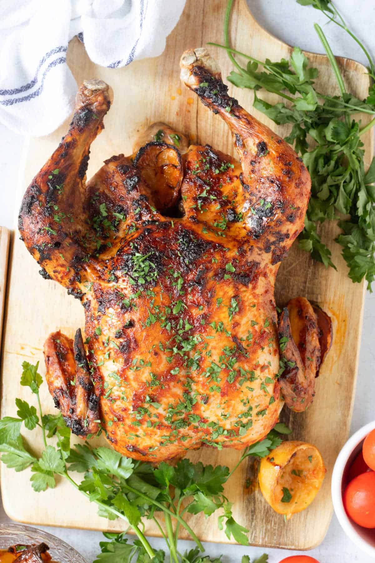Juicy harissa roast chicken ready for carving.