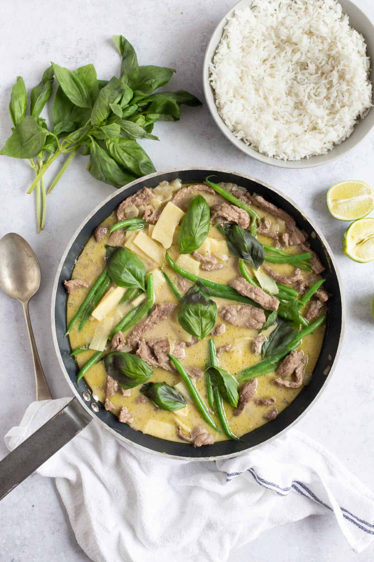 Thai green curry in a wok.