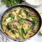 Thai green beef curry in a wok.